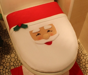 Detail of soft plush Santa Claus toilet seat cover for Christmas home bathroom decoration