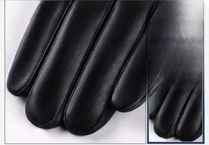Detail of the high-quality PU leather texture and neat stitching on men's winter gloves