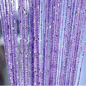 Detailed texture of purple string curtain with shimmering silver sequins for home decor