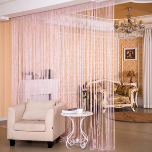 Close-up of pink glitter fringe curtain used as a stylish partition in a modern living room