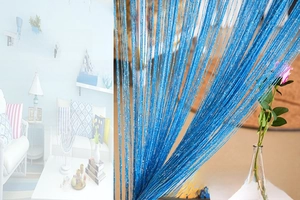 Detail of sky blue string curtain with shimmering silver thread for home partitions