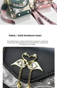 Macro detail of the golden swan buckle with heart-shaped rhinestones and pearl tassels