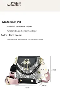 Detail view of paisley print handbag with golden flamingo clasp and pink strap