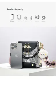 Detail view of floral flap crossbody bag showing capacity compared with a smartphone
