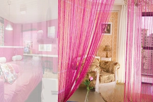 Detailed texture of rose red string curtain with sparkling sequins for door partition