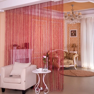 Detail view of red shimmering thread curtain hung in a classic living room interior decor