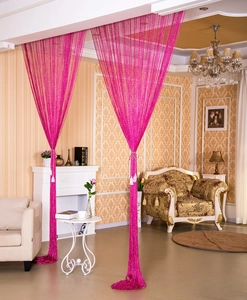 Detail showing bright pink decorative string curtain with subtle metallic glitter finish