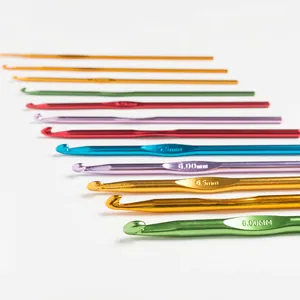 Set of multi-colored aluminum crochet hooks with engraved size markers on white background