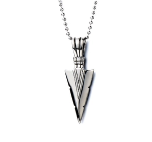 Detailed view of silver arrow pendant necklace with textured geometric lines on ball chain