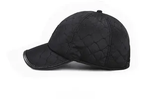 Close-up of black quilted winter baseball hat with ear flaps and leather trim