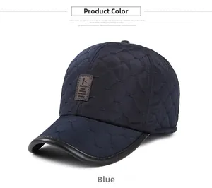 Close-up of blue winter baseball cap with diamond quilting and leather logo patch