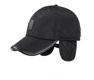 Close-up of black quilted winter baseball cap with foldable ear flaps and logo detail