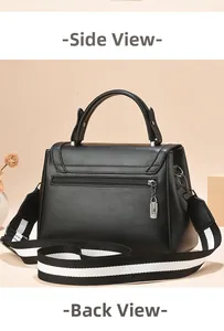 Detail view of the black leather crossbody bag featuring a back zipper and striped strap