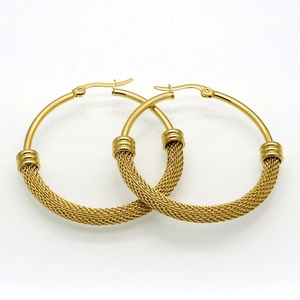 Detailed view of large gold stainless steel hoop earrings featuring a woven mesh design