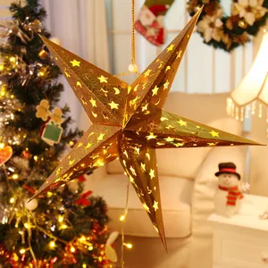 Golden 3D laser star lantern with hollow moon patterns and warm LED light hanging decoration