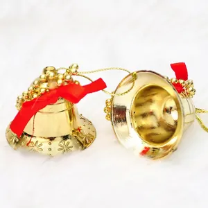 Golden Christmas bell ornaments with red velvet bows and snowflake patterns, set of 6