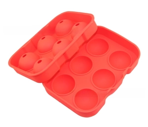 Detail view of a flexible red 6-cavity silicone sphere ice mold in two parts