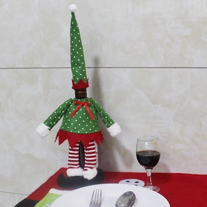 Housse de bouteille de vin lutin de Noël avec robe rouge et jambes rayées pour la table