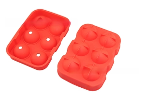 Detail of red food grade silicone ice cube tray featuring 6 holes for round ice balls