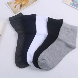 Five pairs of men's cotton crew socks in dark gray, navy, white, black, and light gray