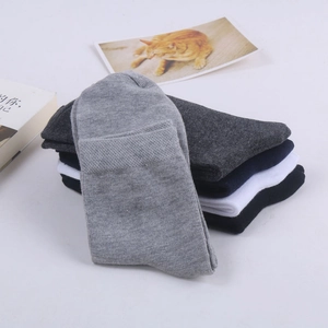 Five-pack of solid color cotton crew socks for men in black, white, and grey shades