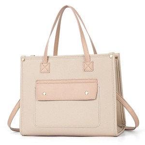 Minimalist beige pebble leather tote bag with large capacity and front rivet pocket detail