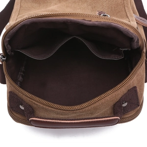 Men's khaki canvas messenger bag featuring multiple interior pockets and zipper closure