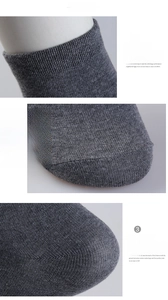 Detail of gray cotton socks showing elastic ribbed cuffs and reinforced heel textures
