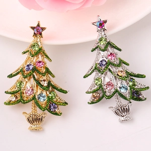 Detailed macro view of colorful rhinestone Christmas tree brooches in gold and silver finish