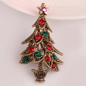 Close-up of vintage Christmas tree brooch with red and green rhinestones and star