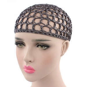 Close-up of handmade crochet hairnet for women with elastic hollow weave and bow detail