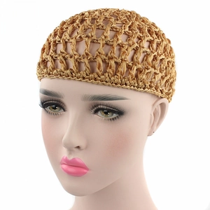 Detailed macro view of the golden handmade crochet mesh hairnet for women's hair styling