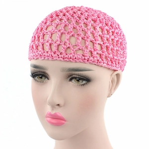 Detail of pink hand-crocheted hair net with mesh honeycomb pattern on model