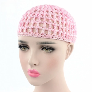 Detailed view of pink handmade crochet hair net cap with mesh knit on a mannequin
