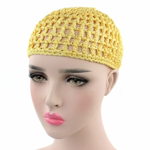 Close-up of bright yellow handmade crochet hair net featuring hollow mesh pattern