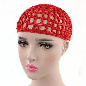 Detail of red handmade crochet hair net with large mesh and bow on a mannequin head