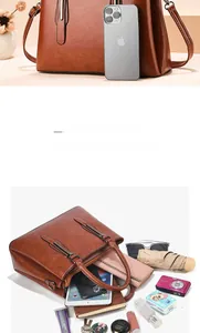Brown litchi grain tote bag showing large capacity by comparison with phone and essentials