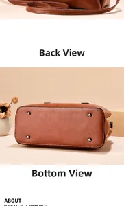 Detail view of brown leather bag showing neat stitching and bottom metal protective studs
