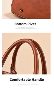 Detail view of brown leather bag featuring bottom metal rivets and comfortable handle straps