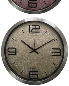 Macro shot of silver metal wall clock with glittery gold dial and quartz movement