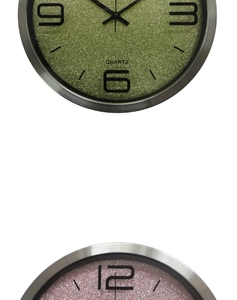 Macro detail of quartz wall clock showing glitter dial texture and silver metal frame