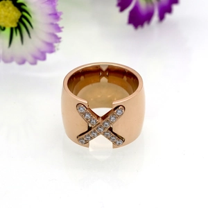 Detailed macro view of X-shaped cross ring with micro-pave cubic zirconia stones