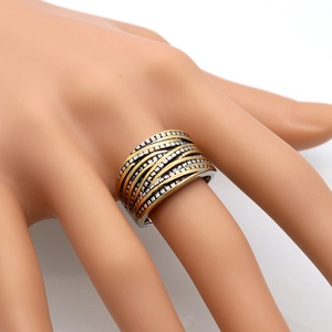 Vintage layered two-tone stainless steel cable ring with textured beaded surface on finger