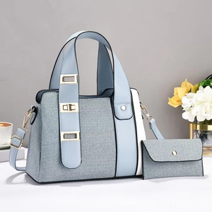 Fashionable light blue patchwork handbag set with woven texture and gold metal hardware