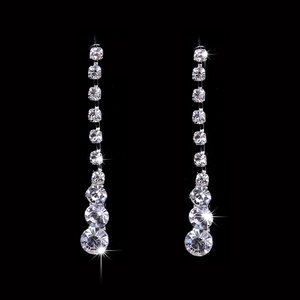 Elegant silver dangling earrings featuring multiple sparkling round rhinestones for weddings