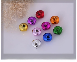 Macro shot of colorful vacuum plated bells with top loops for DIY craft and holiday decor