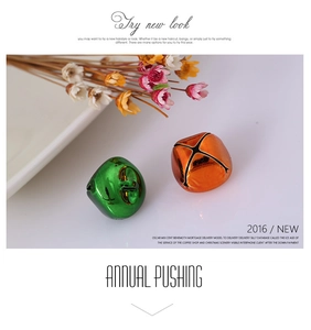 Detail of colorful cross-opening metal bells for Christmas DIY and pet accessories