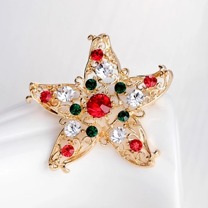 Golden star brooch with red and green rhinestones for festive Christmas styling