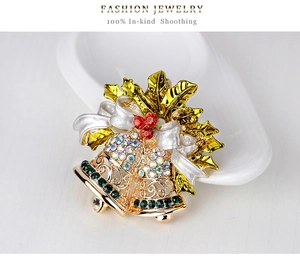 Detailed Christmas bell brooch with golden holly leaves and colorful rhinestones