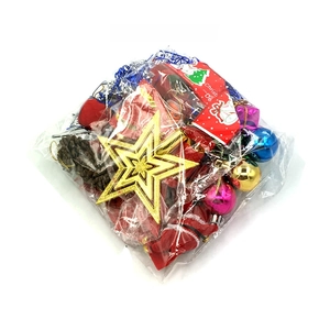 Detail of Christmas tree ornaments including baubles and cones in plastic bag packaging
